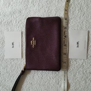 NWOT COACH WRISTLET CLUTCH METALLIC BURGUNDY